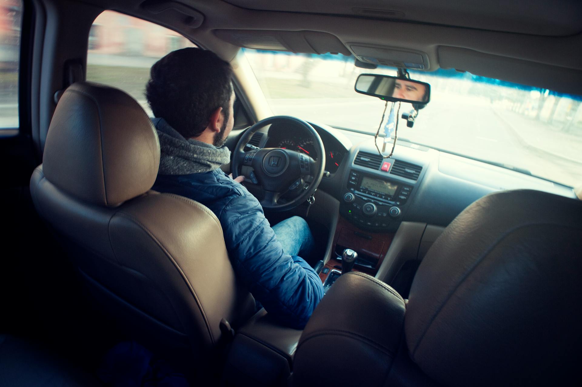 A man driving a car | Source: No source