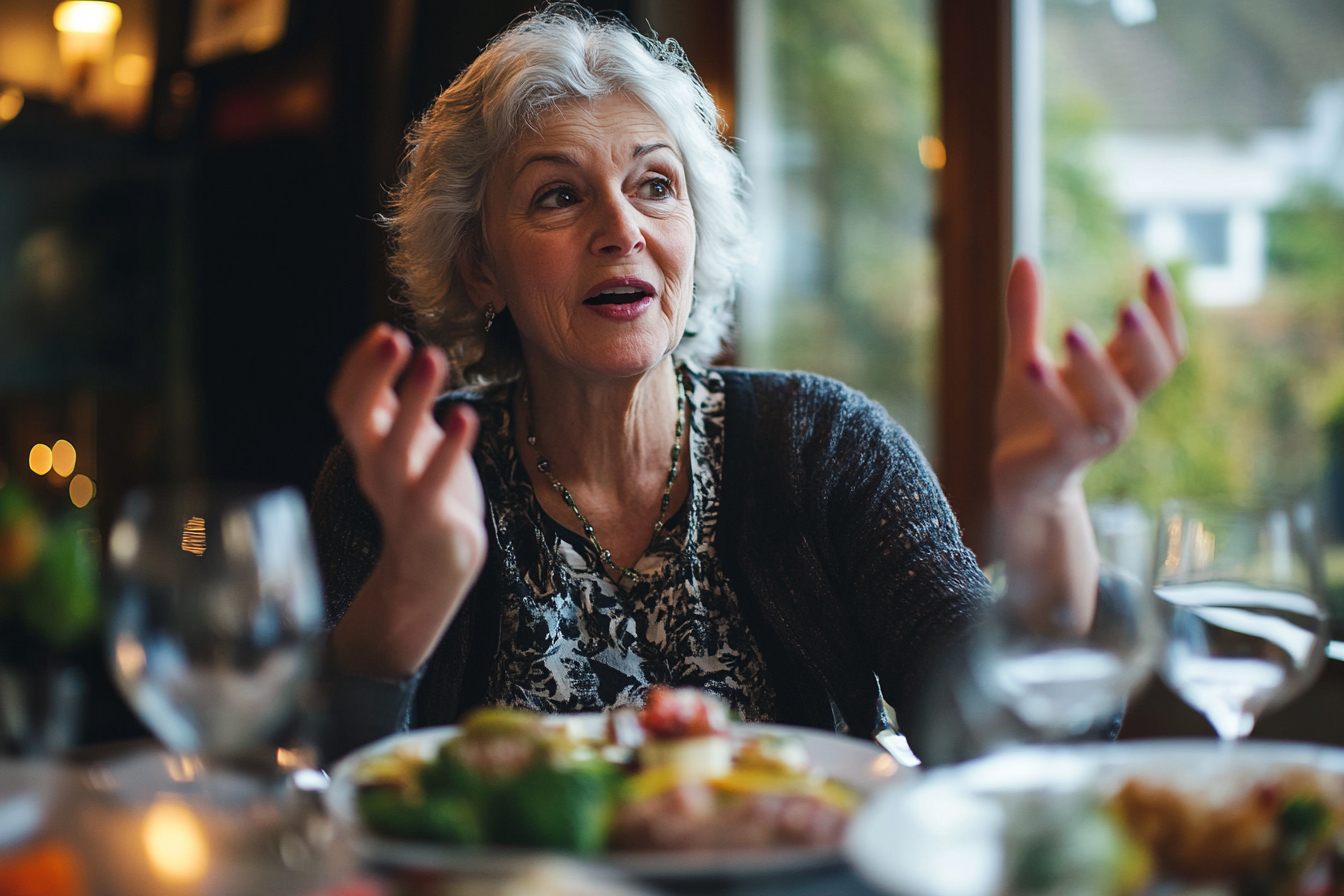 A woman speaking during dinner | Source: No source