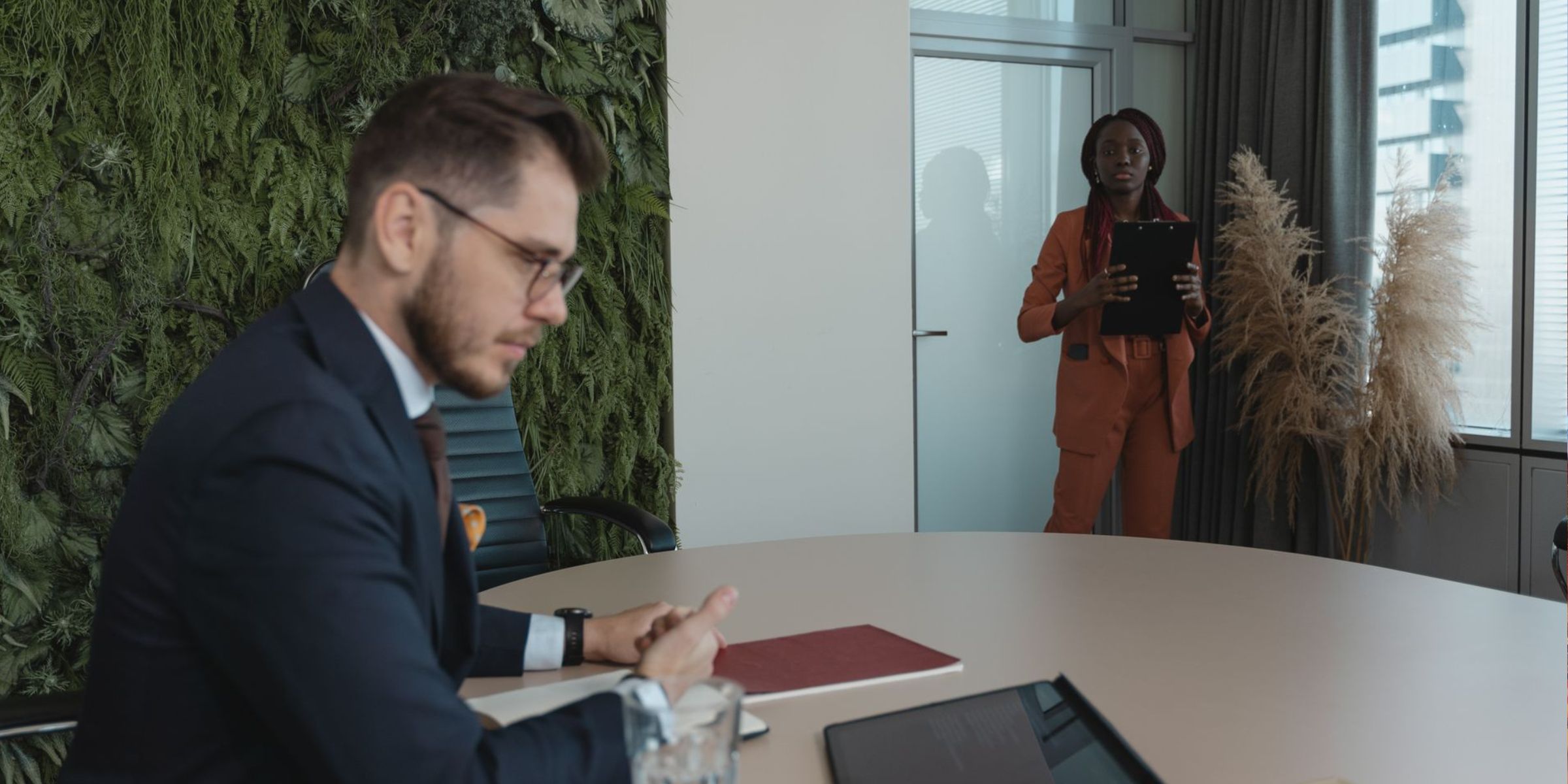 A business meeting between a man and a woman in a modern office | Source: Pexels