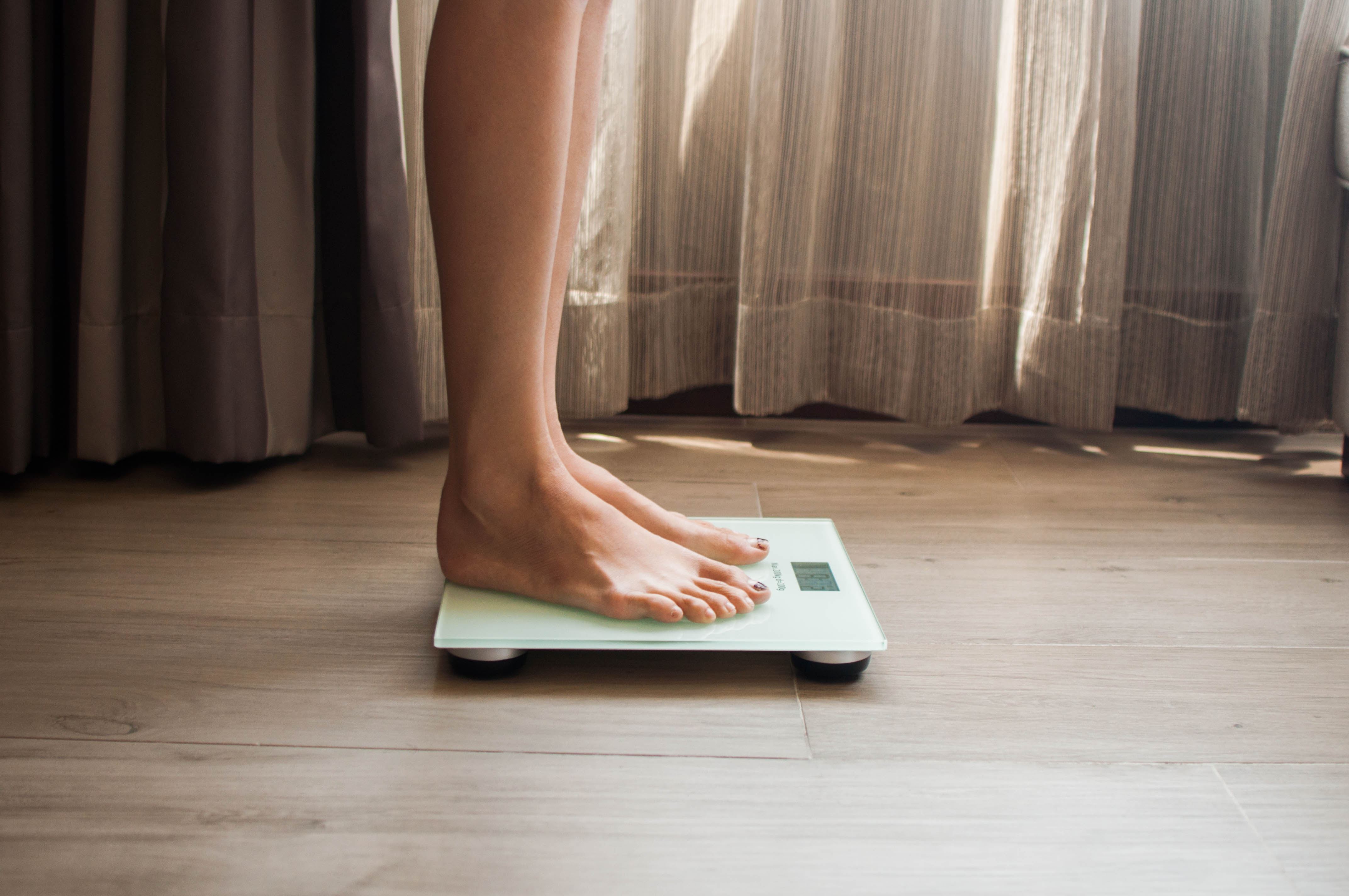 Woman on the digital scales | Source: Getty Images