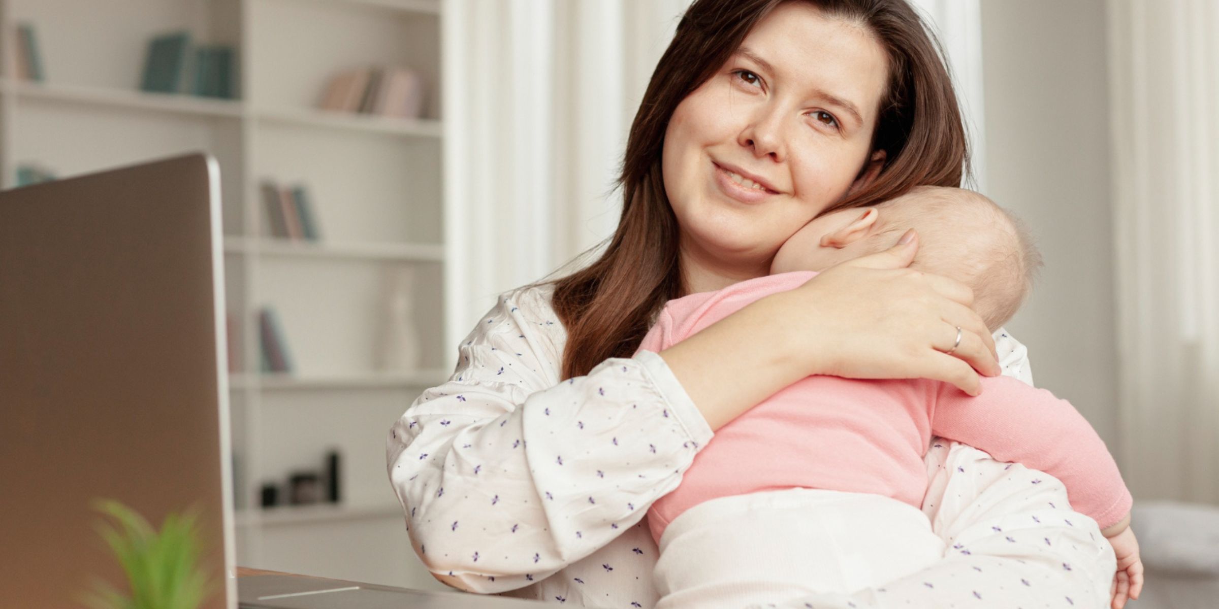 A mother holding her baby | Source: No source