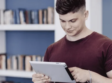 Boy with laptop | Source: Shutterstock.com