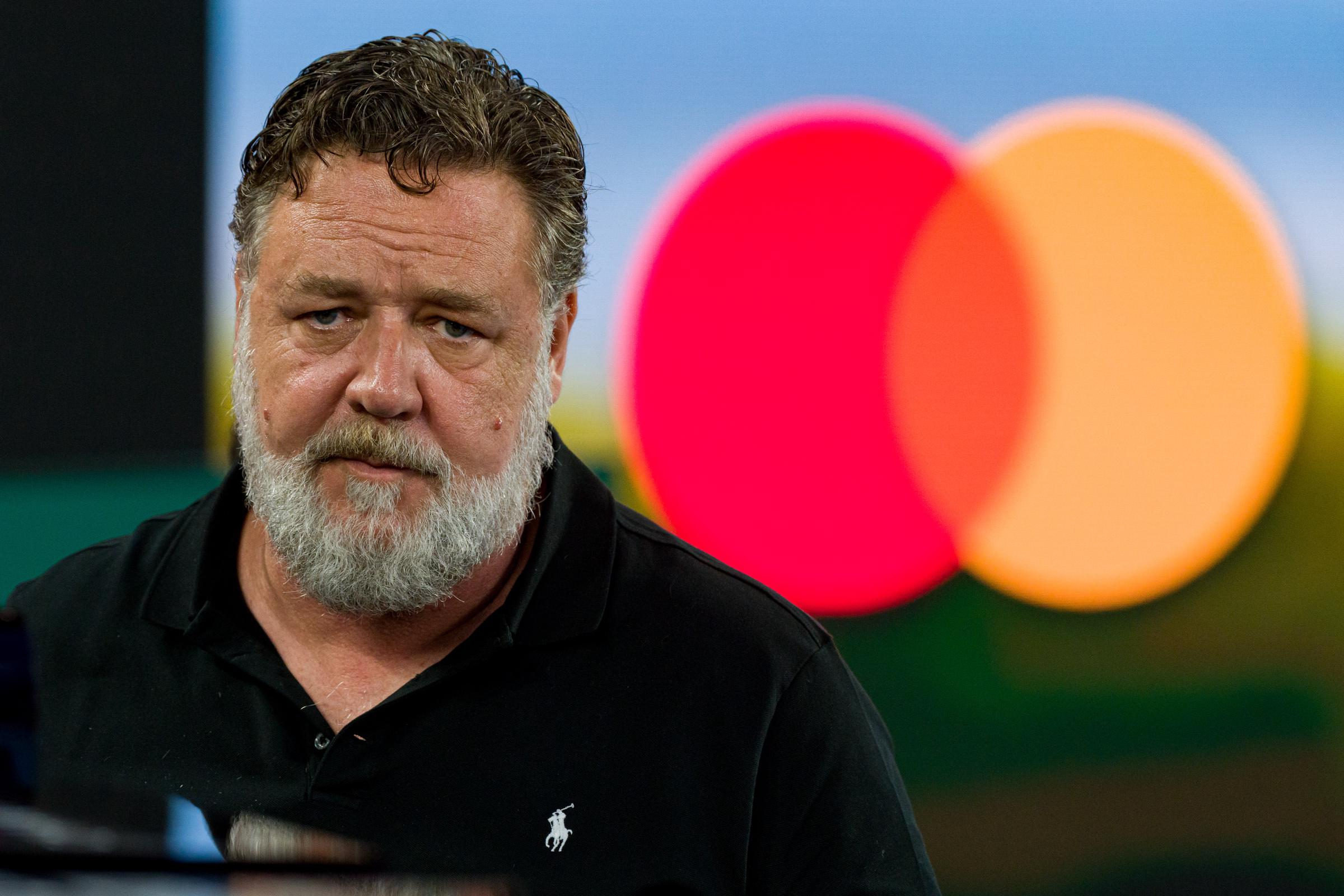 Russell Crowe was photographed courtside at the Women’s Singles Final during Day 13 of the 2023 Australian Open on January 28 in Melbourne. With a thick white beard and dressed in a black polo, the "Gladiator" actor appeared serious and deep in thought as he watched the match.