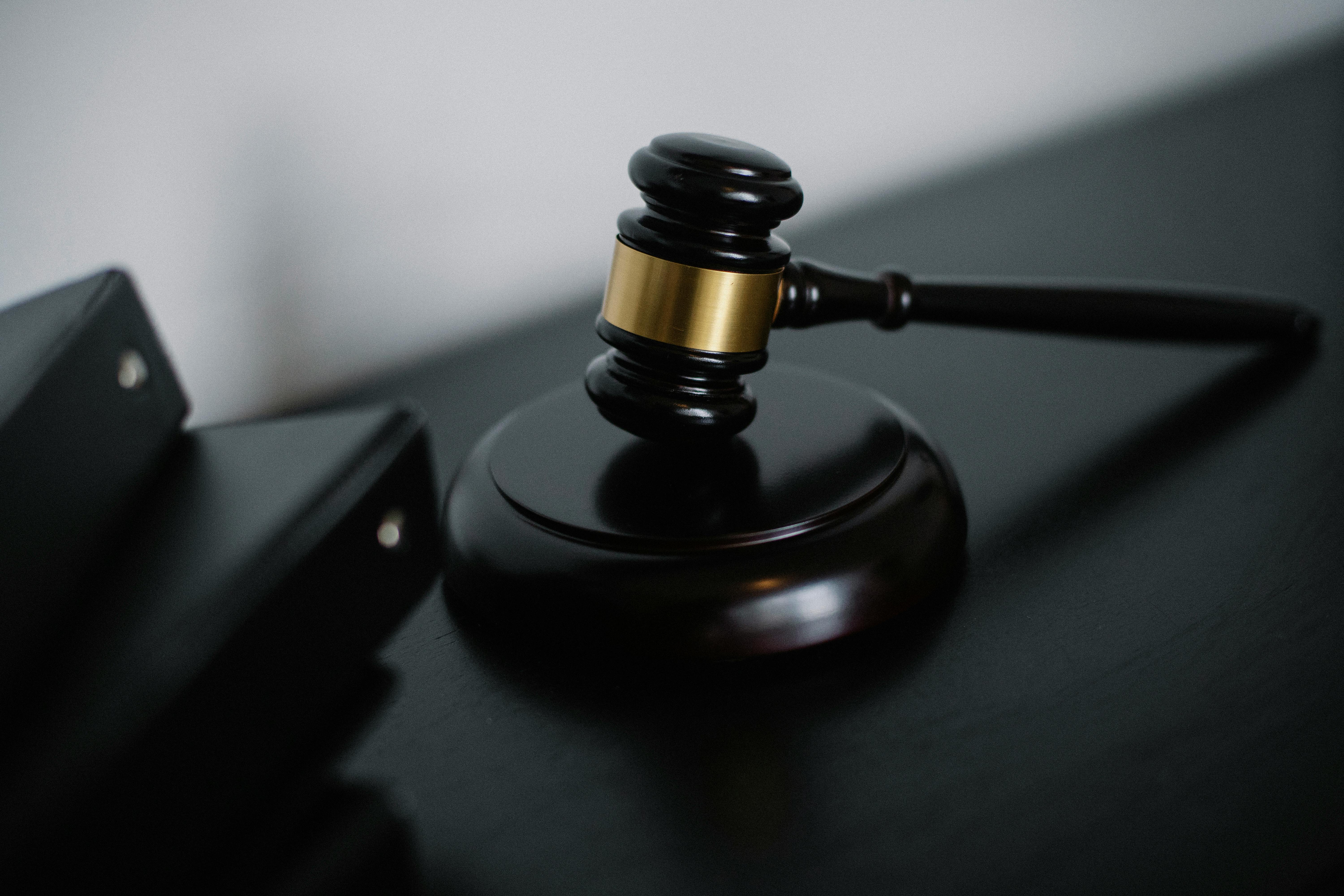 Close-up of a judge's gavel on a sound block | Source: Pexels