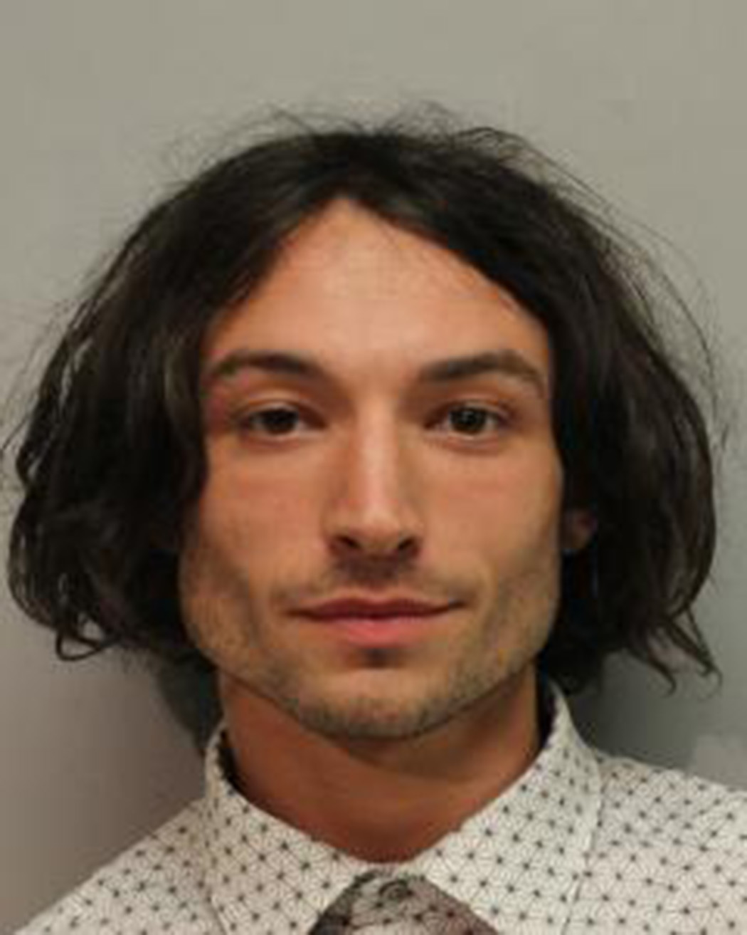 Ezra Miller is seen in a police booking photo after his arrest for disorderly conduct and harassment in Hilo, Hawaiʻi on March 28, 2022. | Source: Getty Images