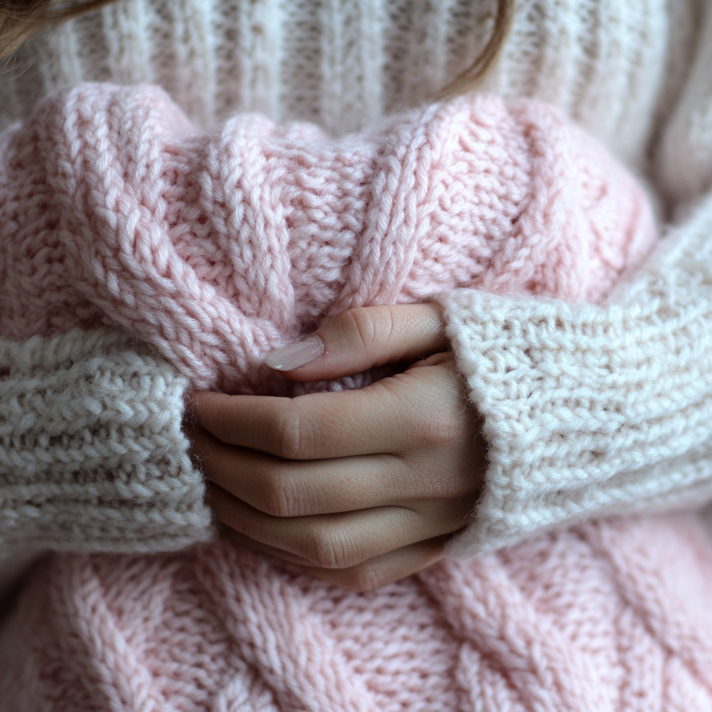 A woman holding a baby blanket | Source: No source