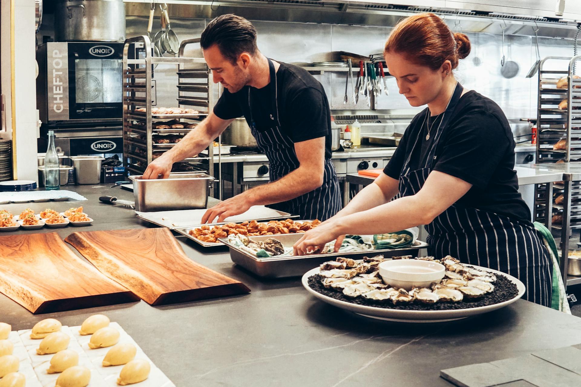 Kitchen staff plating food | Source: Pexels