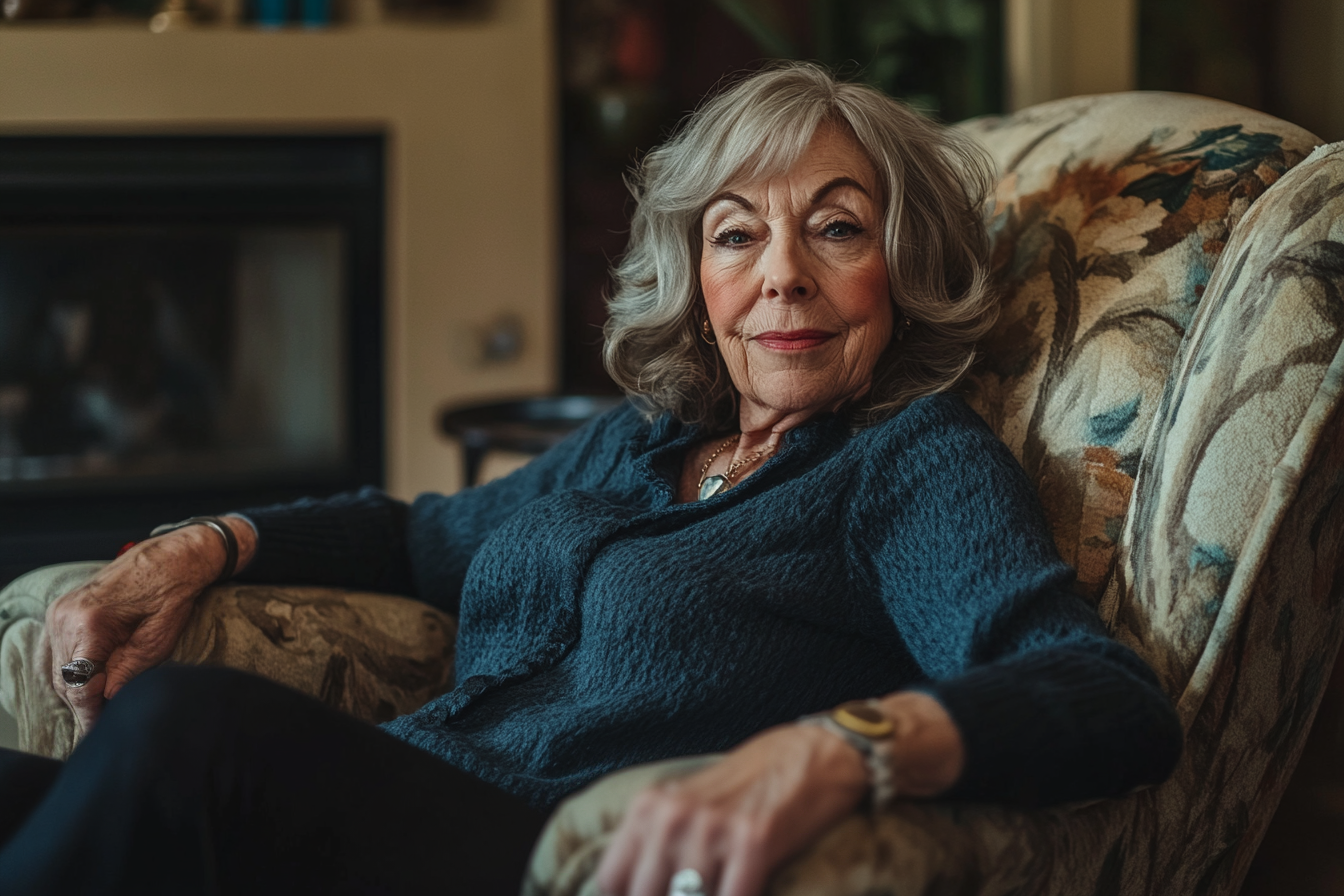 An older woman sitting on a couch with a haughty expression | Source: no source