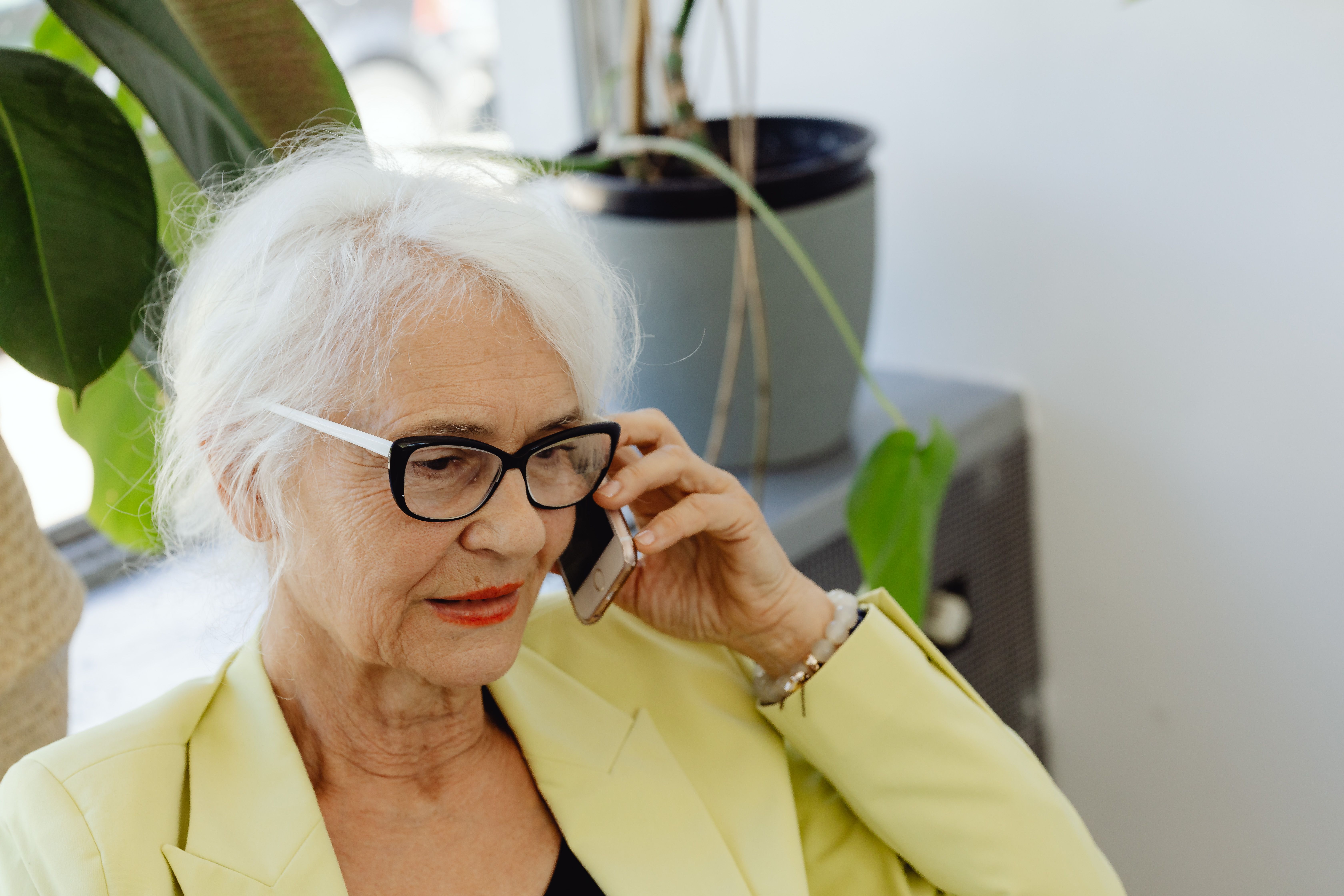 An elderly woman on the phone | Source: Pexels