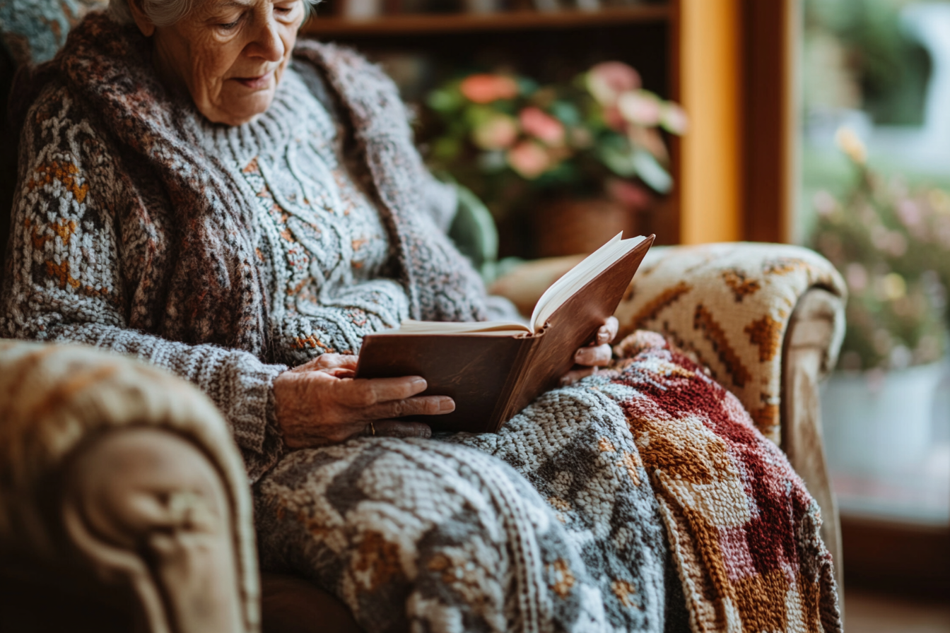 A woman reading in an armchair | Source: no source