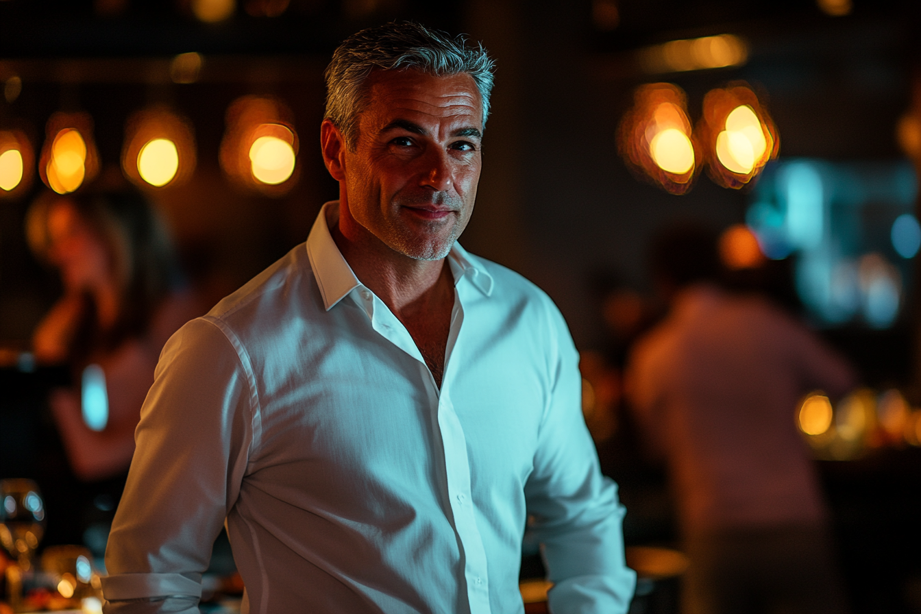 Restaurant manager smiling | Source: No source