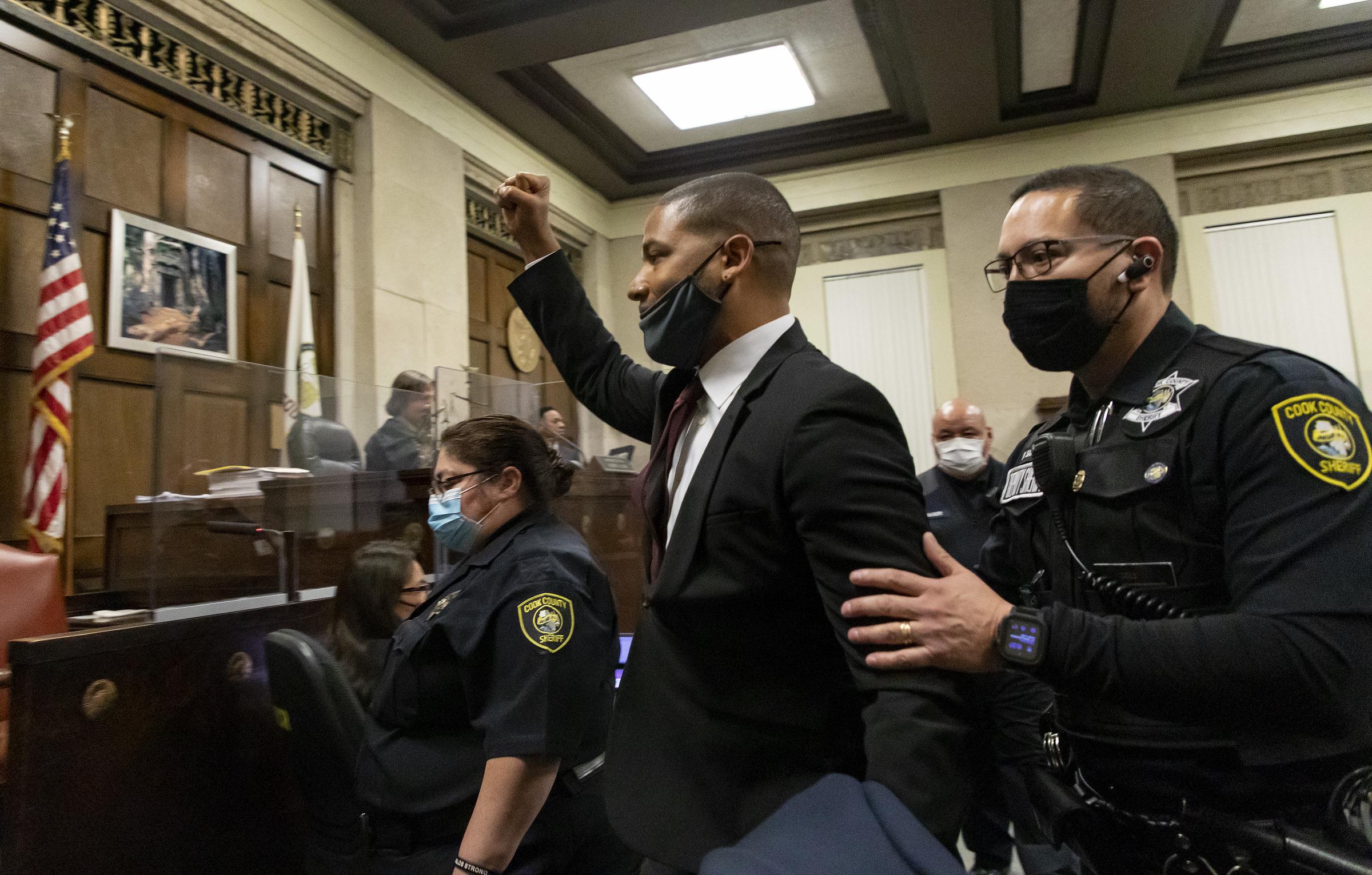 Jussie Smollett is led out of the courtroom after being sentenced at the Leighton Criminal Court Building in Chicago, Illinois  on March 10, 2022. | Source: Getty Images