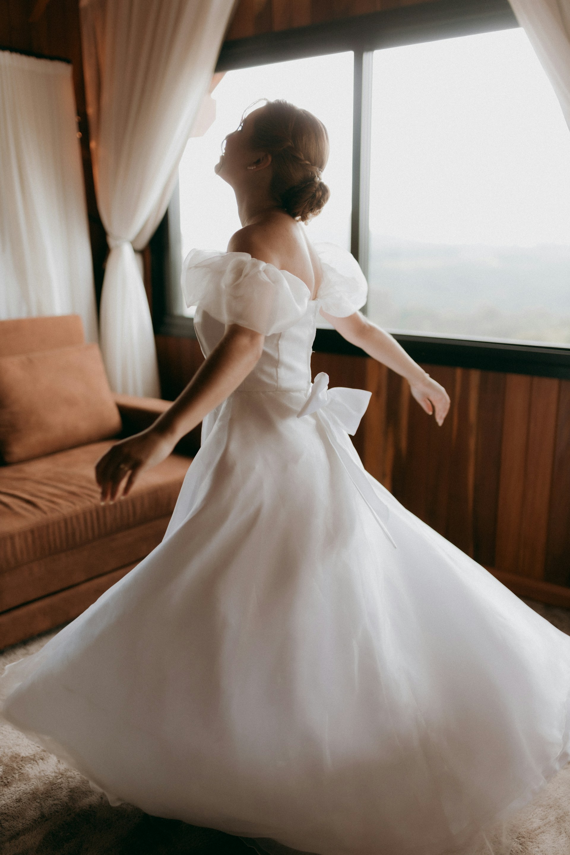 A delighted woman wearing a white wedding gown | Source: Unsplash