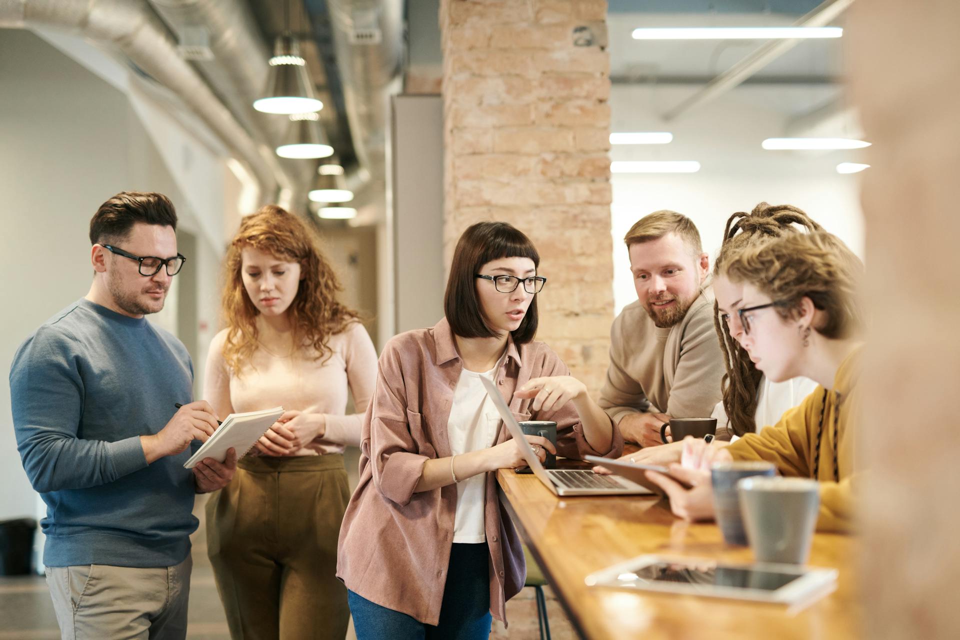 People talking to each other in an office | Source: Pexels