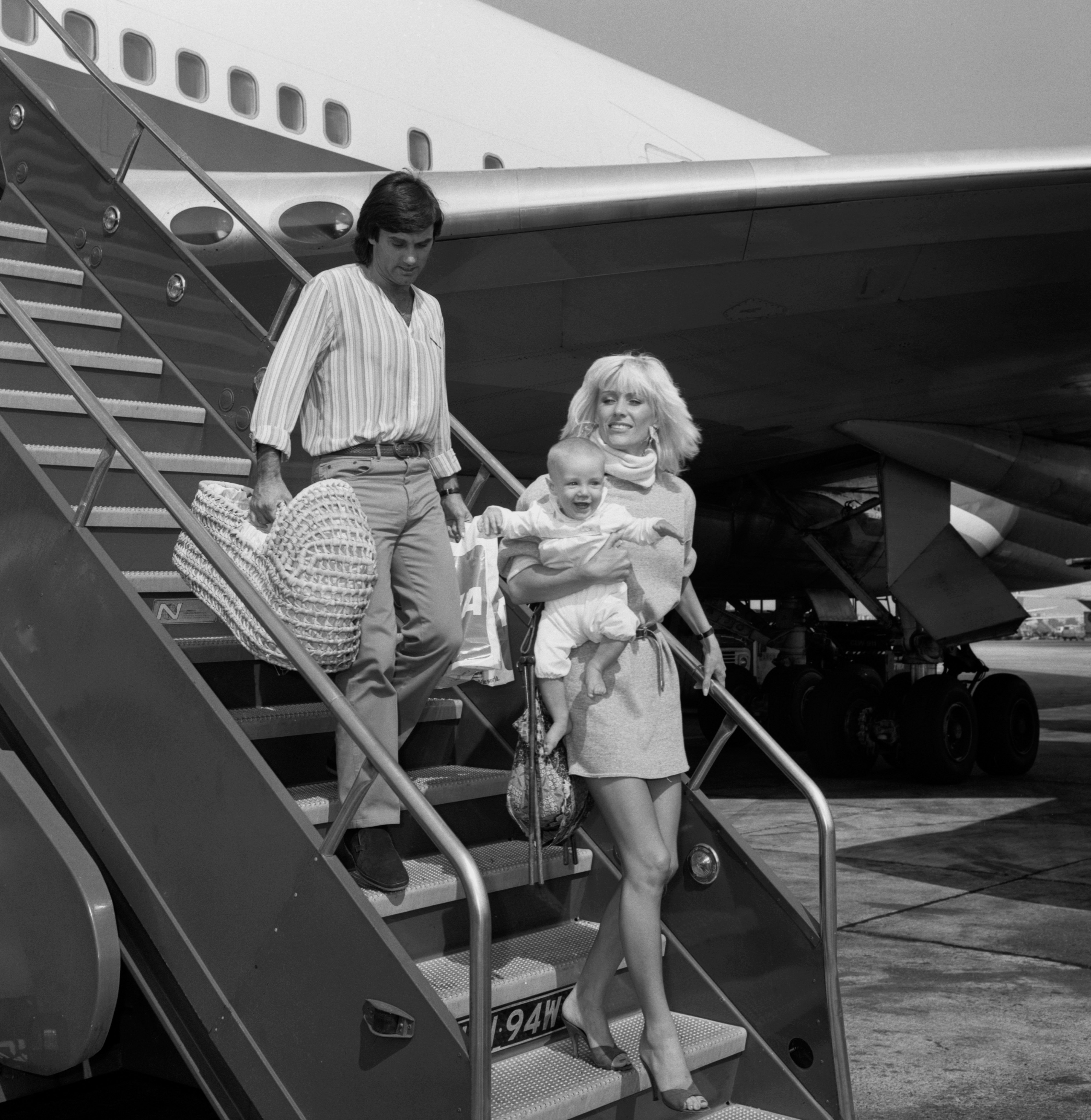 Former soccer superstar George Best, with his wife Angie and their son Calum Milan Best, at Heathrow Airport today after having flown in from Los Angeles. | Source: Getty Images