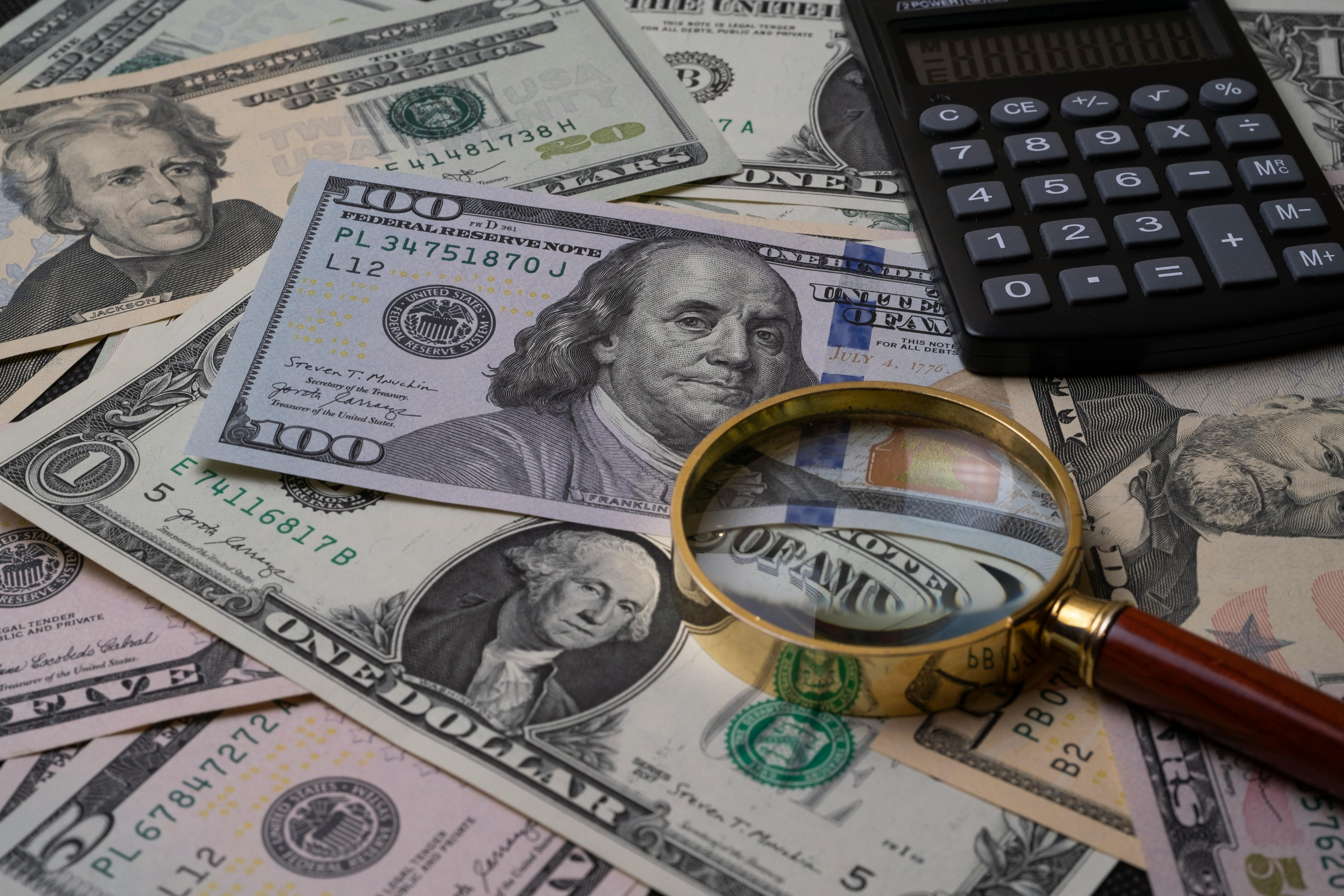 Money and calculator on the table | Source: Pexels