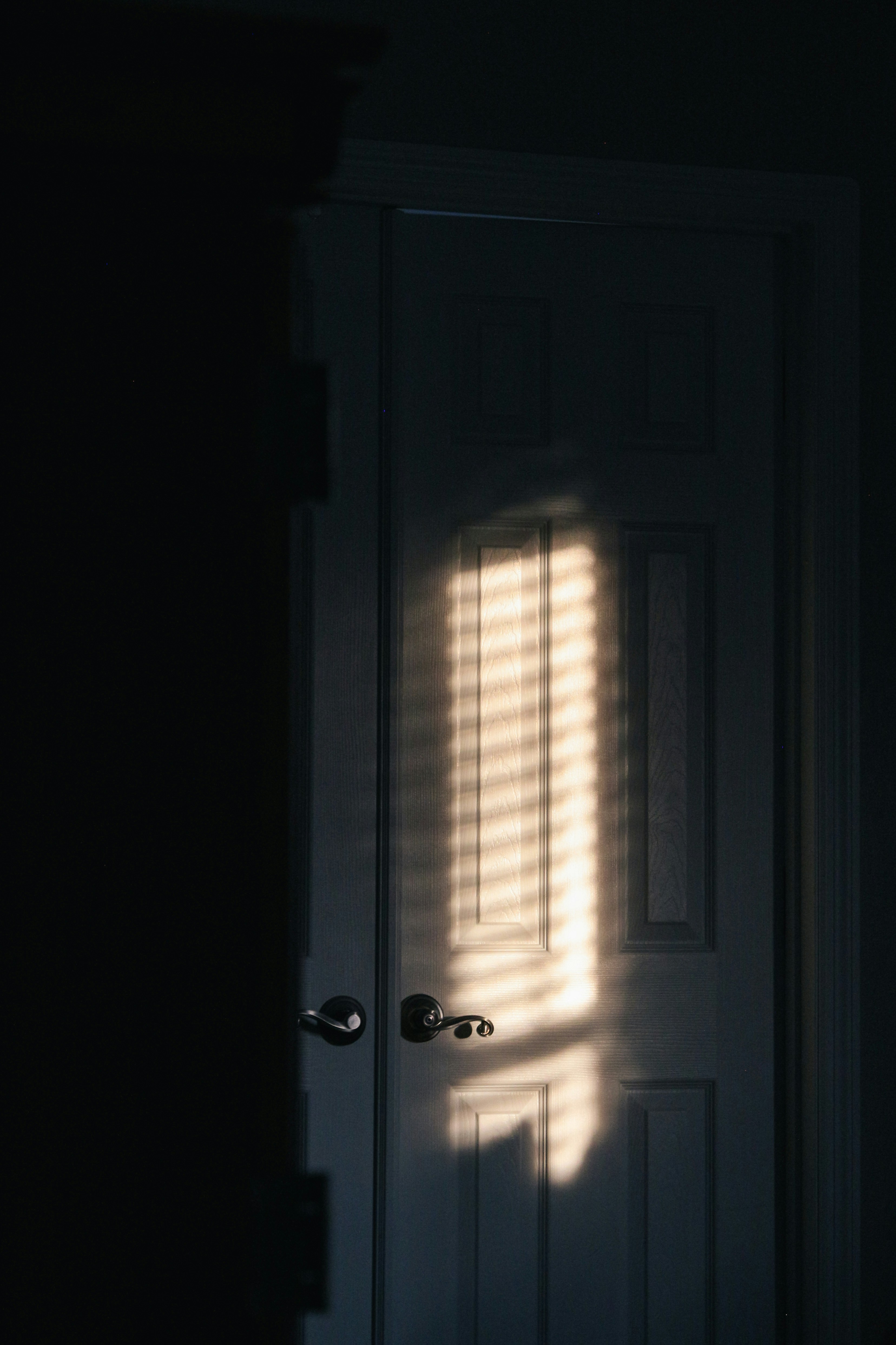 A closed bedroom door | Source: Unsplash