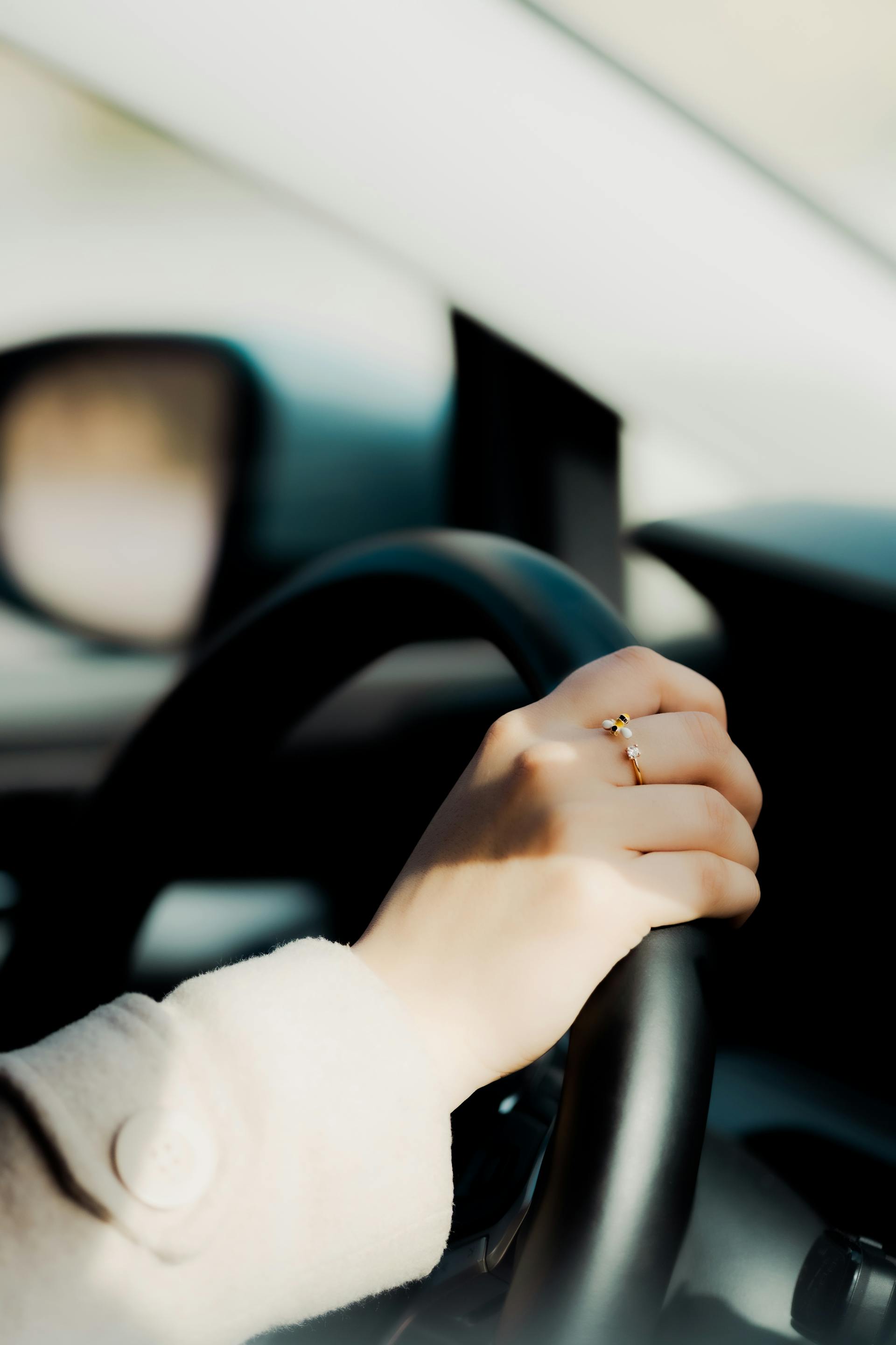 A woman driving a car | Source: Pexels