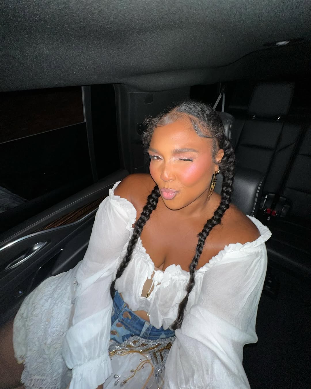 Lizzo in a white dress, 2022 | Source: instagram.com/lizzobeeating