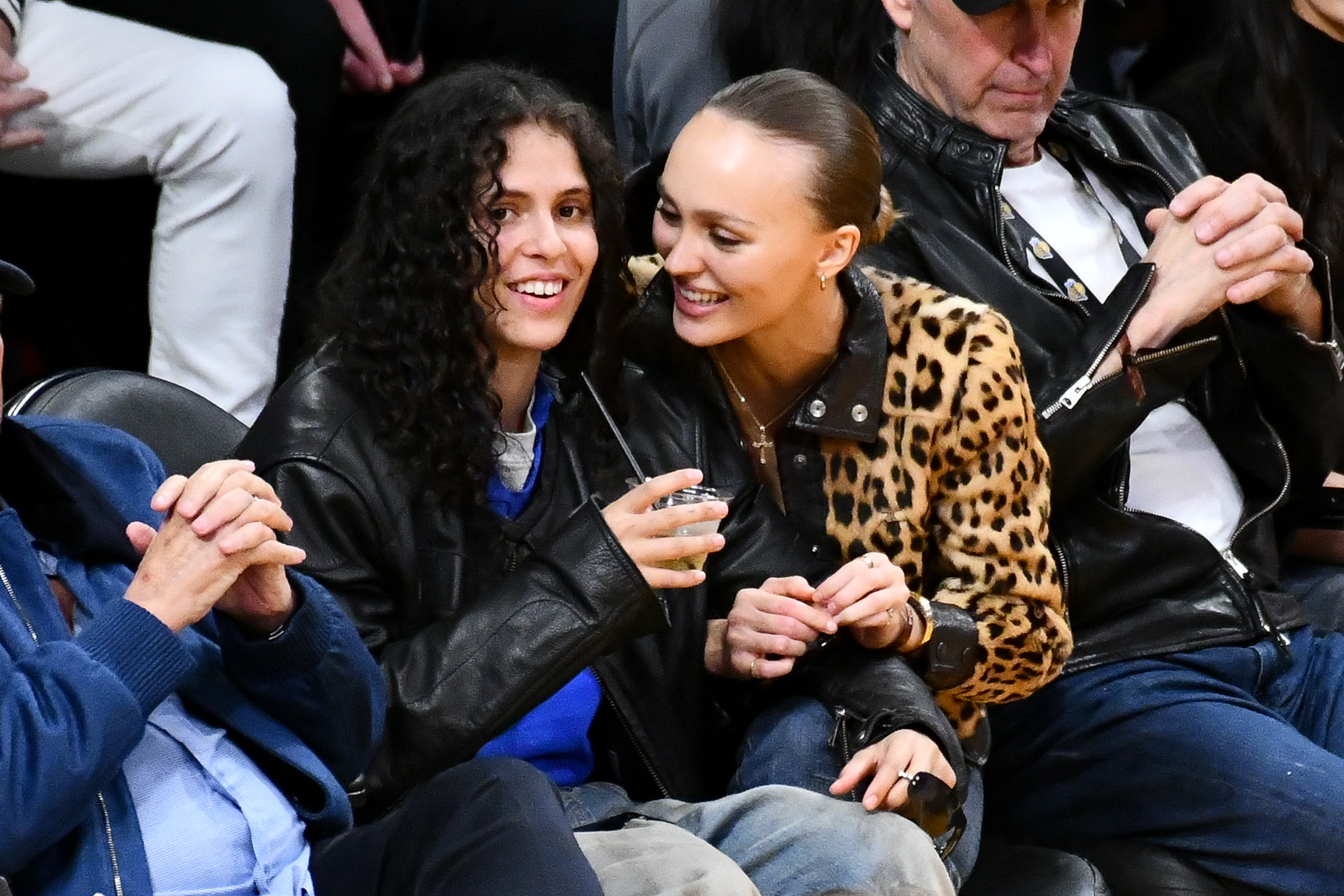 Lily-Rose Depp and 070 Shake share a sweet moment while attending a Los Angeles Lakers game at Crypto.com Arena on March 10, 2024 | Source: Getty Images