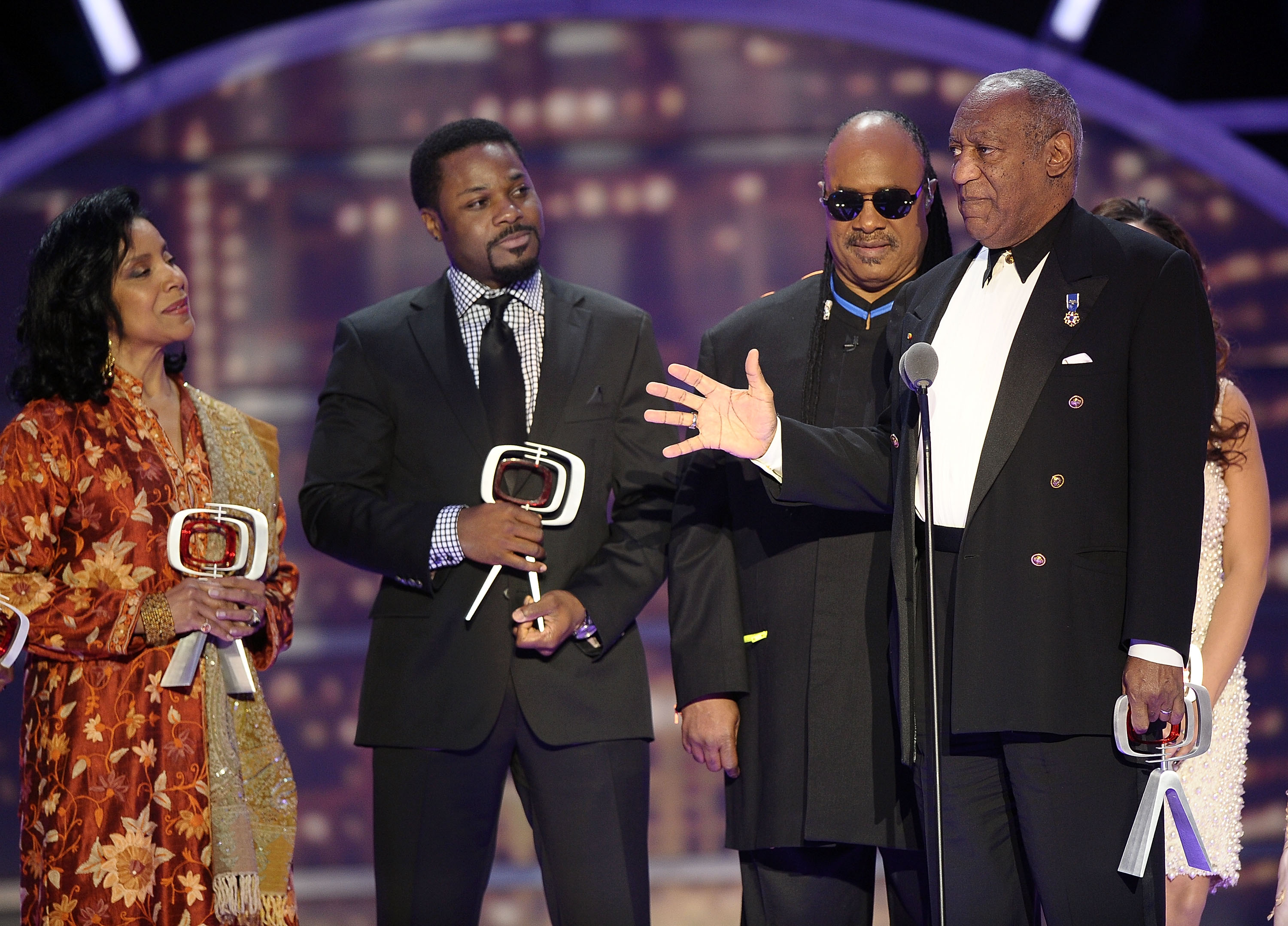 Bill Cosby accepts the Impact Award alongside Stevie Wonder, Phylicia Rashad, and Malcolm-Jamal Warner at the 9th Annual TV Land Awards in New York City on April 10, 2011. | Source: Getty Images