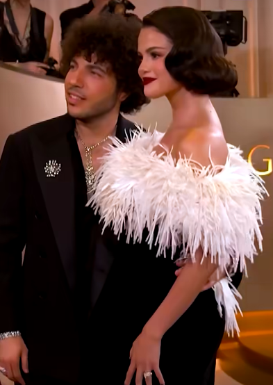 Benny Blanco and Selena Gomez posing with their arms wrapped around each other. | Source: Facebook/Entertainment Tonight