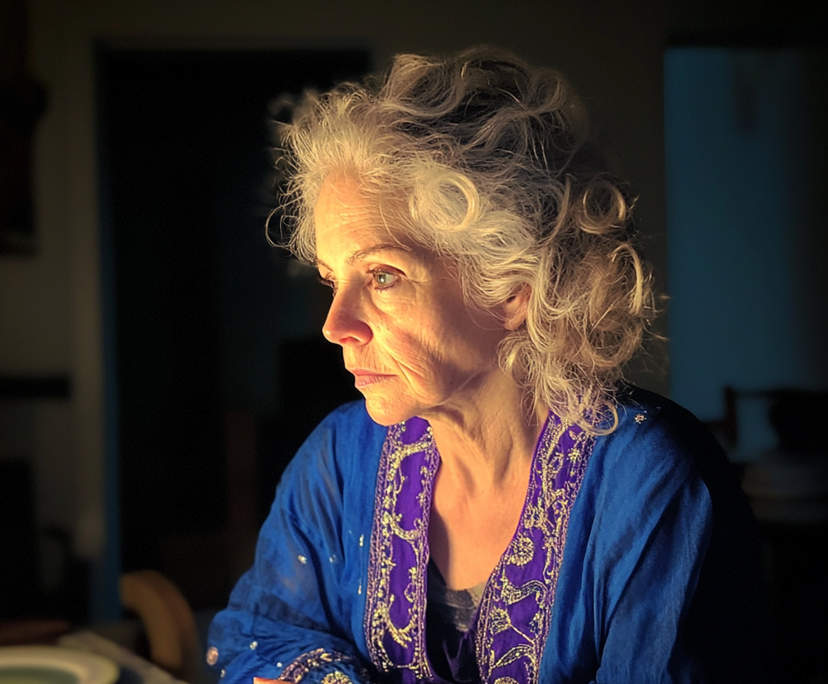 A pensive woman sitting at a table | Source: no source