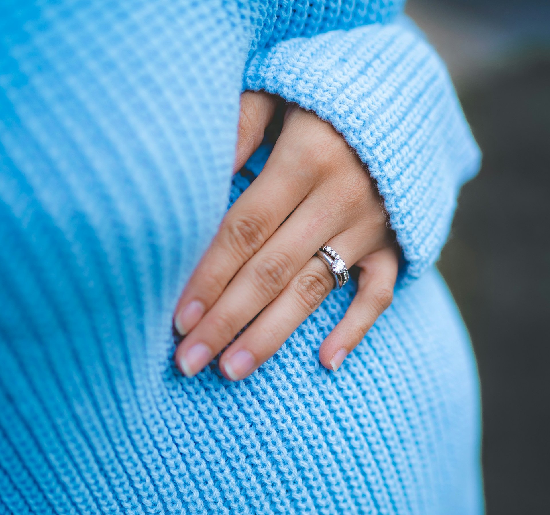 A pregnant woman holding her belly | Source: Unsplash