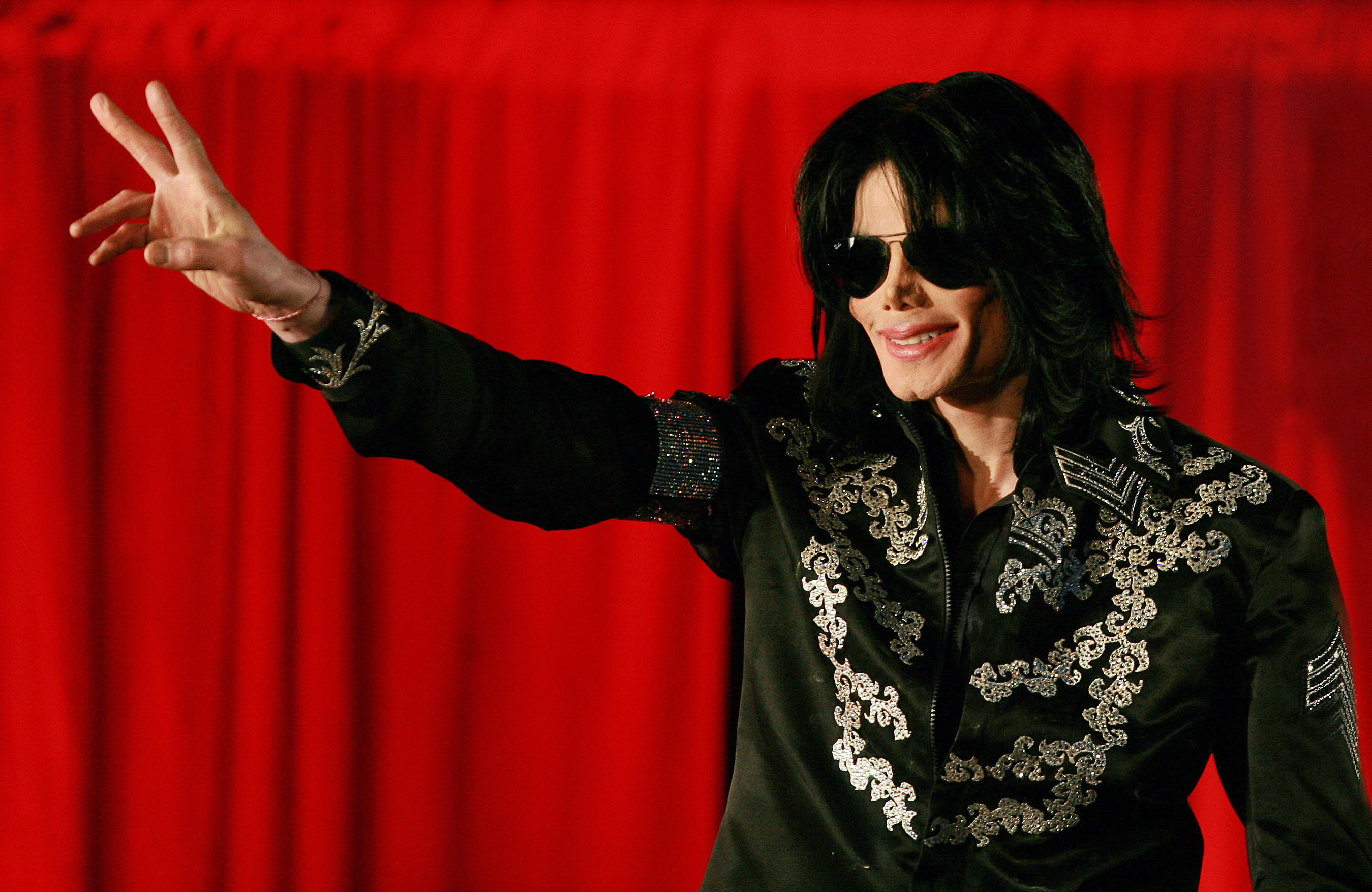 Michael Jackson makes a peace sign gesture the O2 arena in London in March. | Source: Getty Images