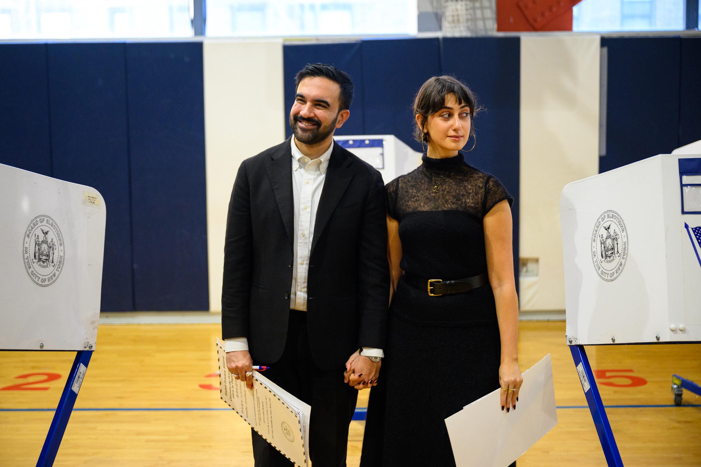 Democratic Mayoral Candidate Zohran Mamdani and his wife, Rama Duwaji, pose for media after voting at The Frank Sinatra School of the Arts on November 4, 2025, in the Queens borough of New York City | Source: Getty Images