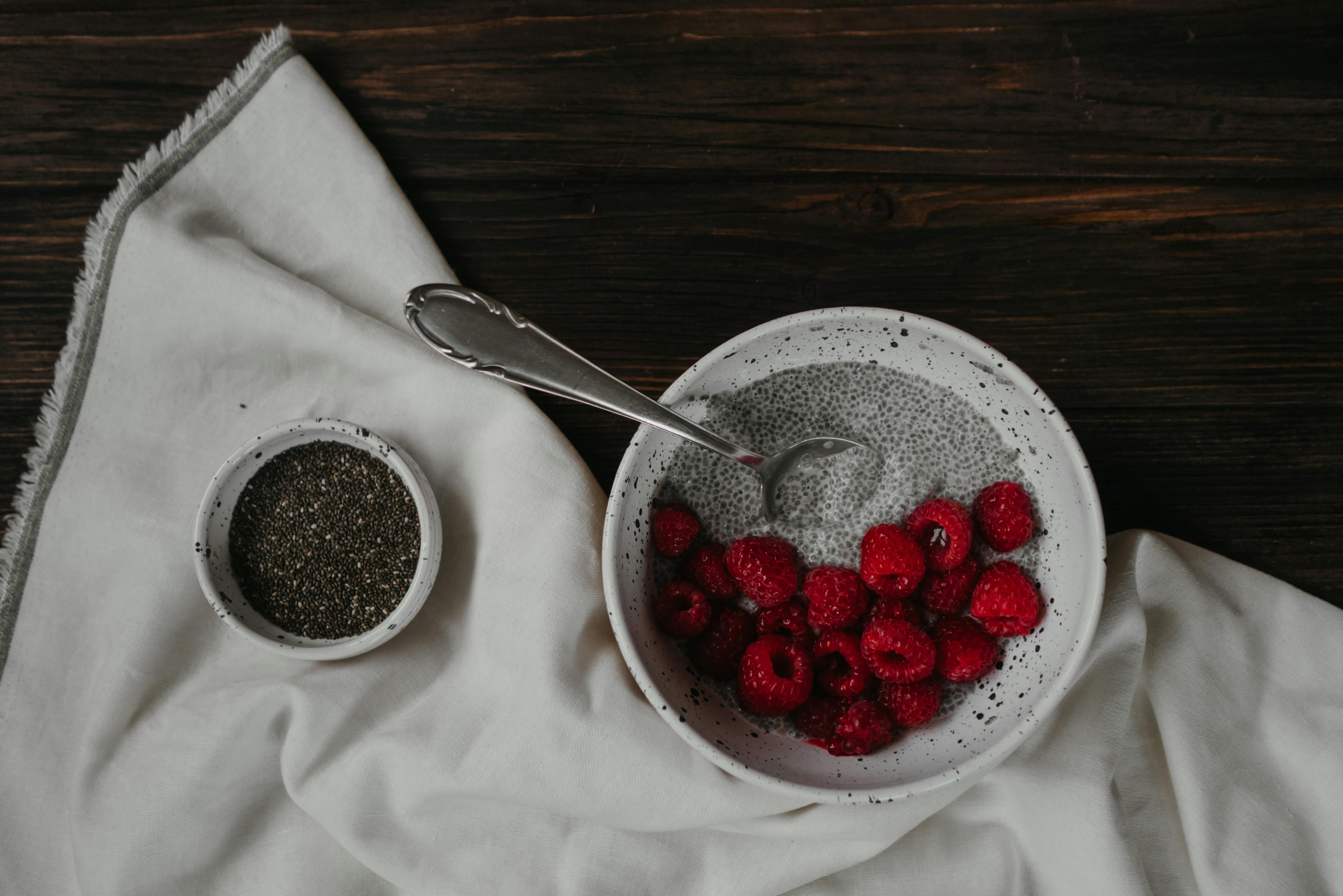 Red strawberries on a white ceramic bowl | Source: Pexels