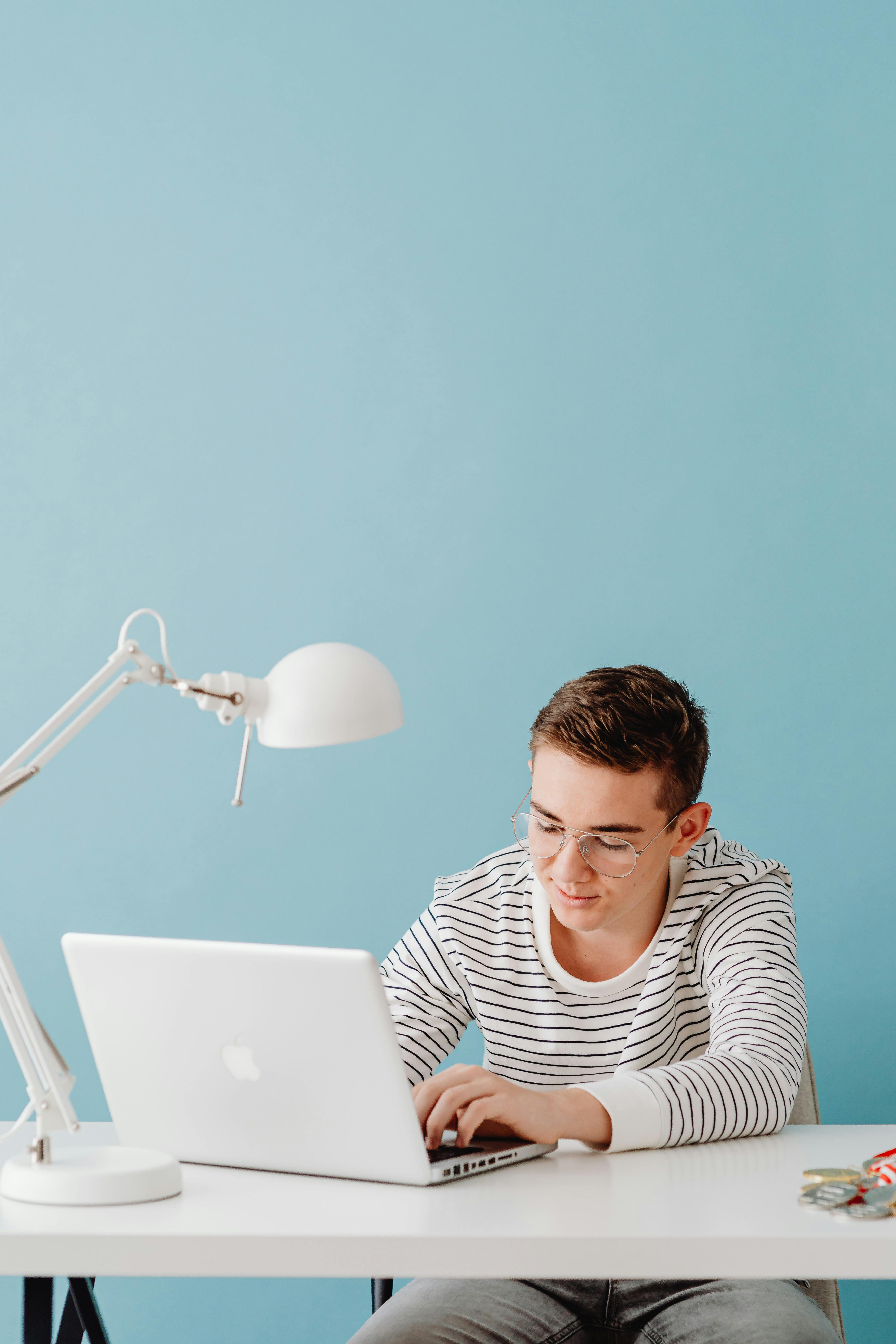 A man working on a laptop in his home office | Source: Pexels