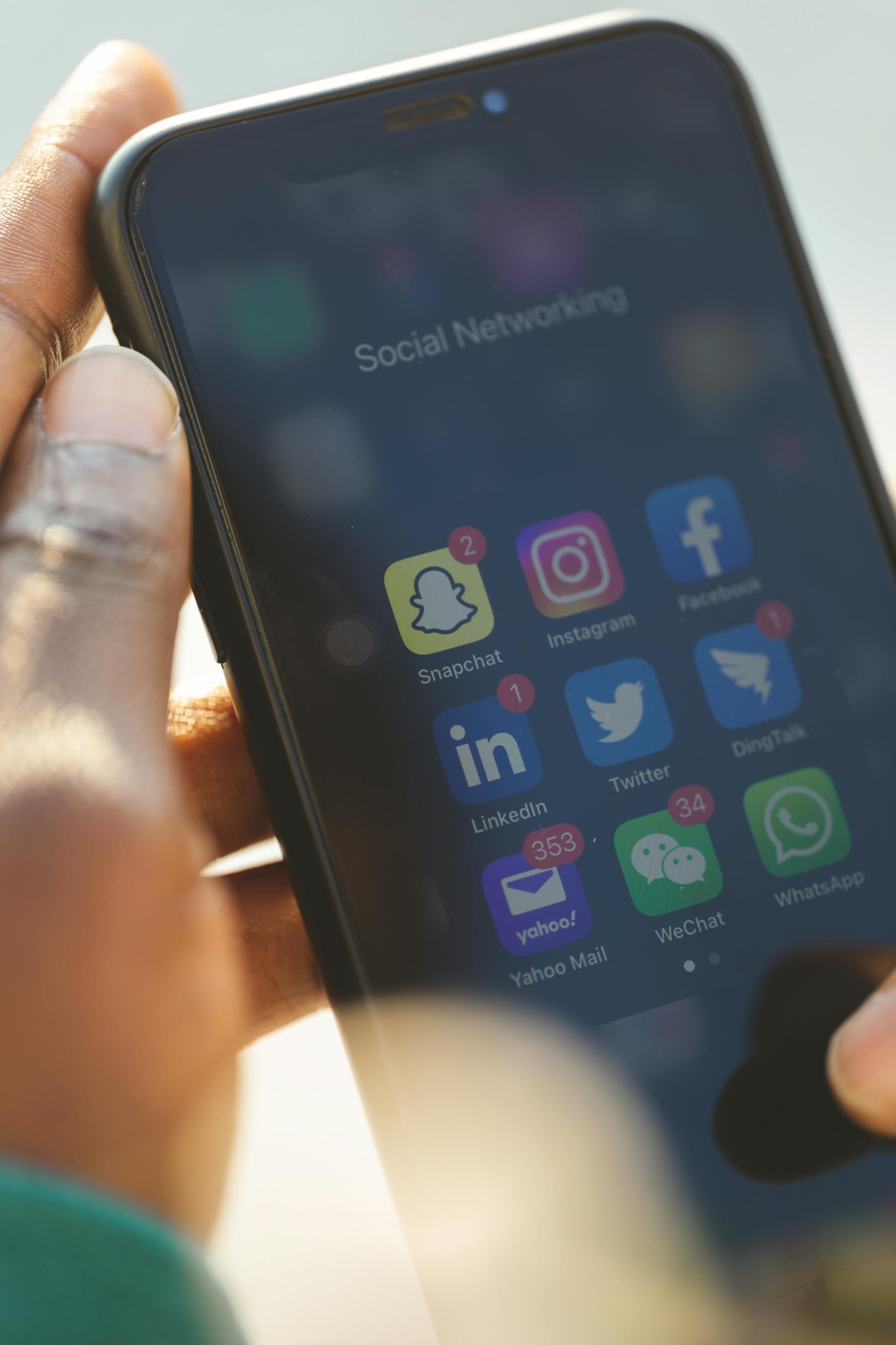 A phone screen displaying app icons with numerous notifications | Source: No source