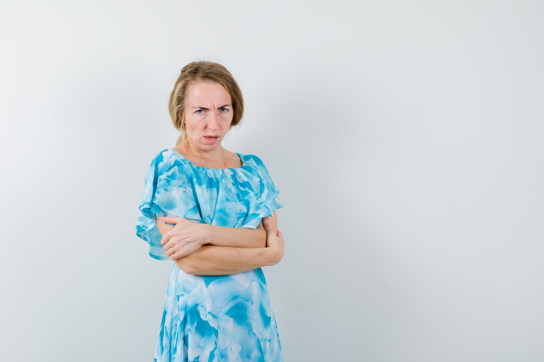 An angry middle-aged woman with her arms folded | Source: Freepik