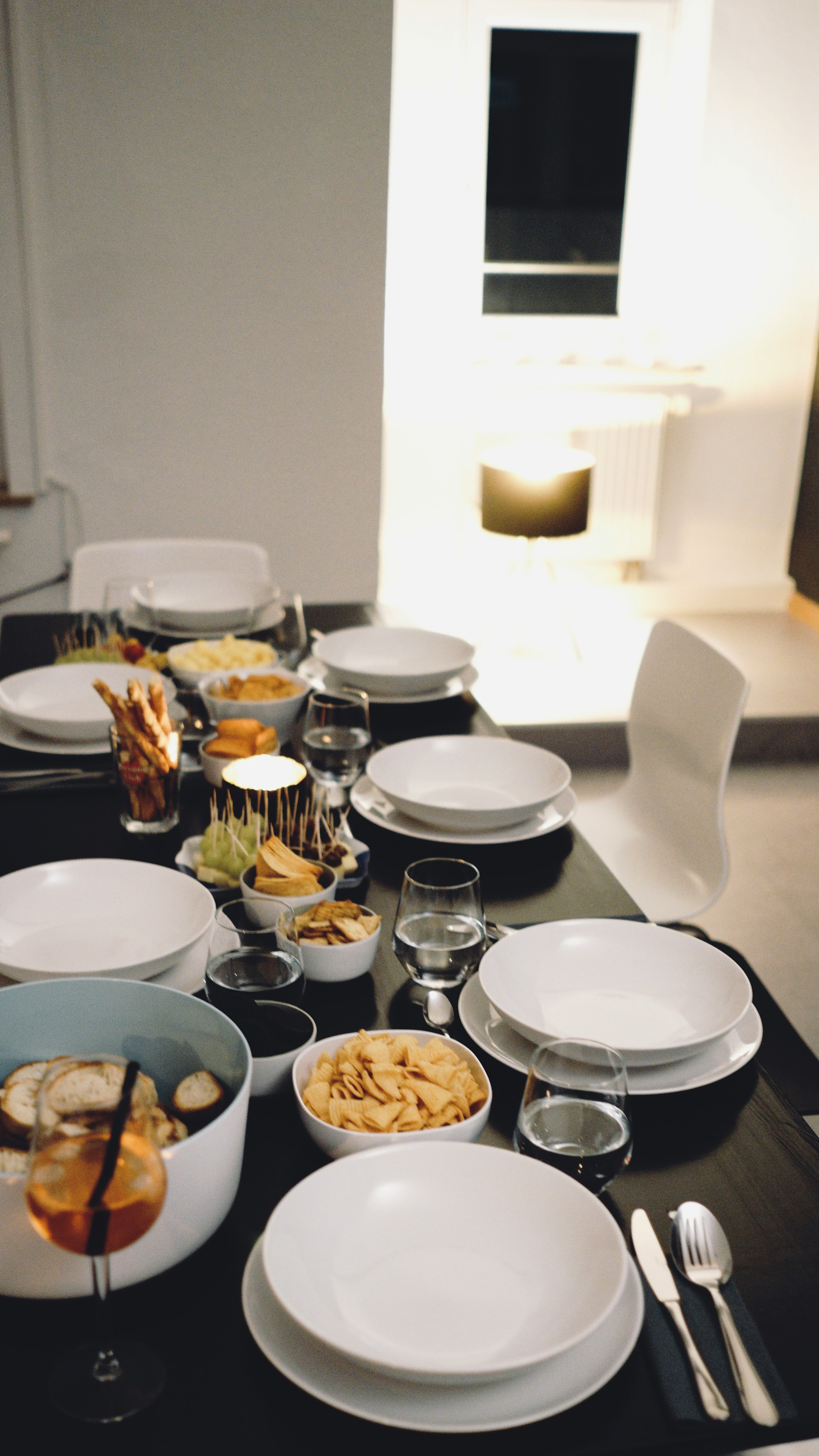 A table set with food, drinks, and plates | Source: Unsplash