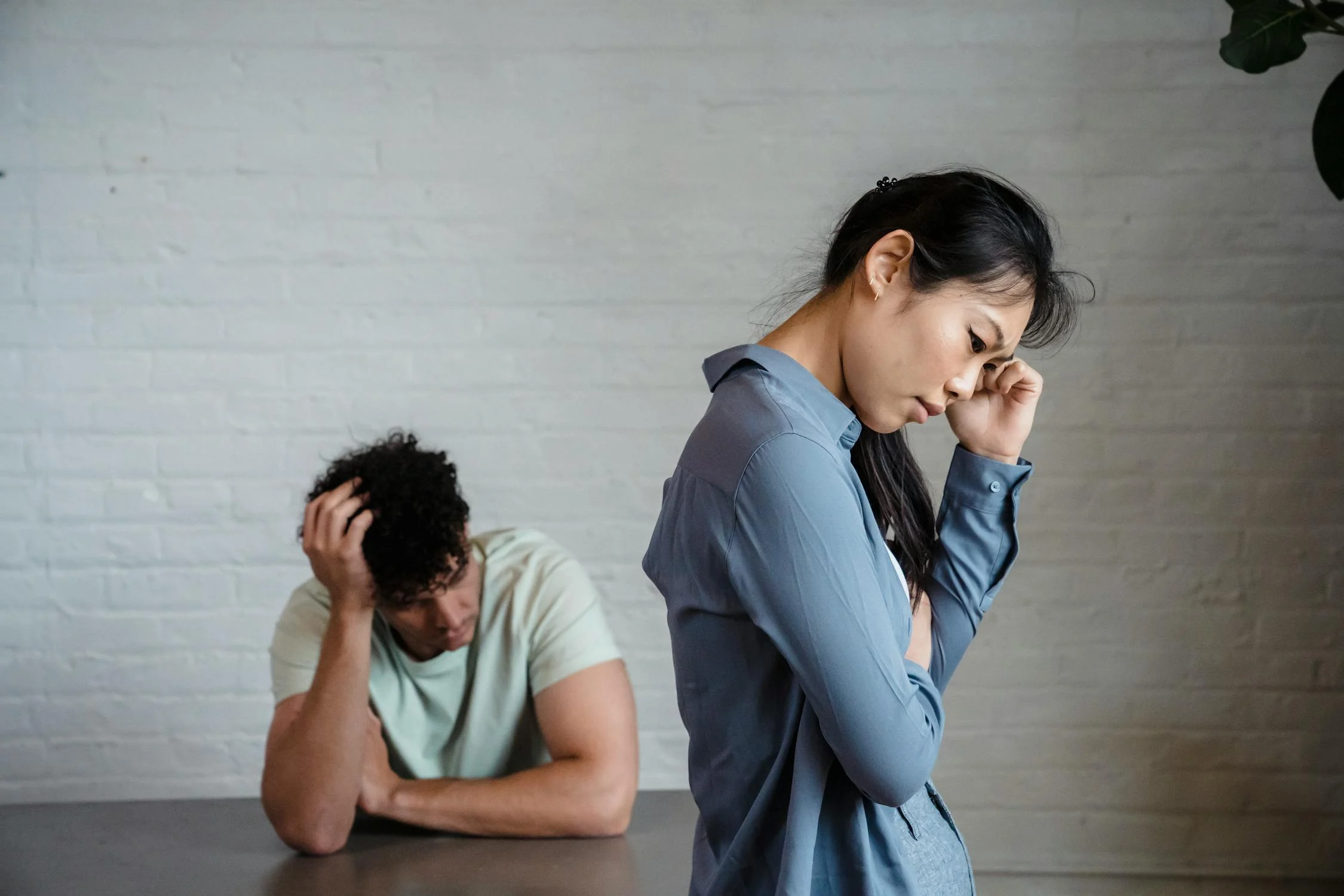 A thoughtful woman and her sad husband | Source: Pexels
