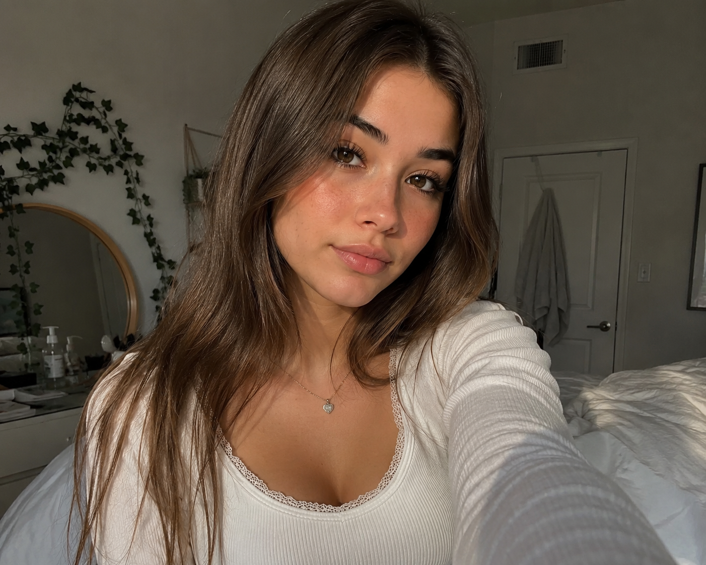Young girl taking a selfie at home | Source: Amomama