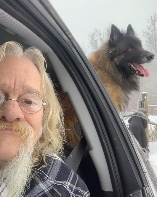 Billy Brown with a dog in a car on April 13, 2023 | Source: Instagram/amibrownwolfpackmama
