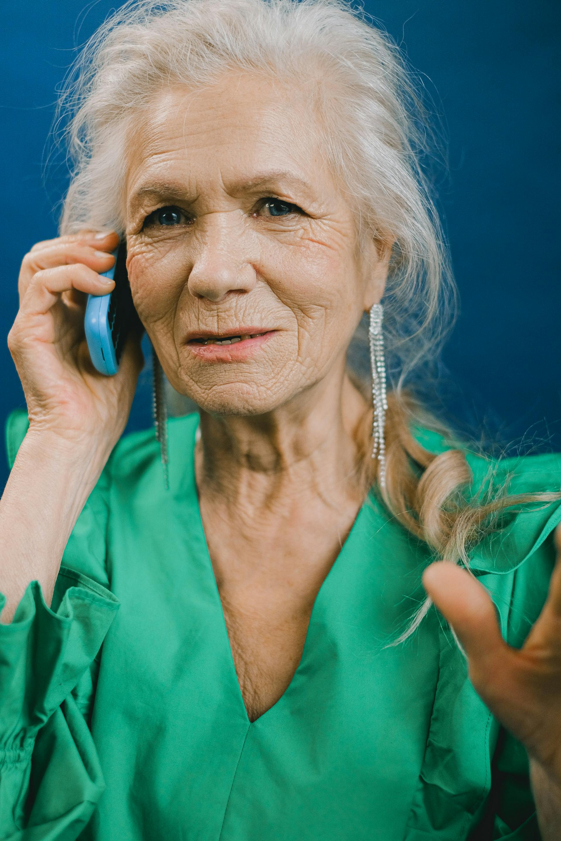 A senior woman talking on the phone | Source: Pexels