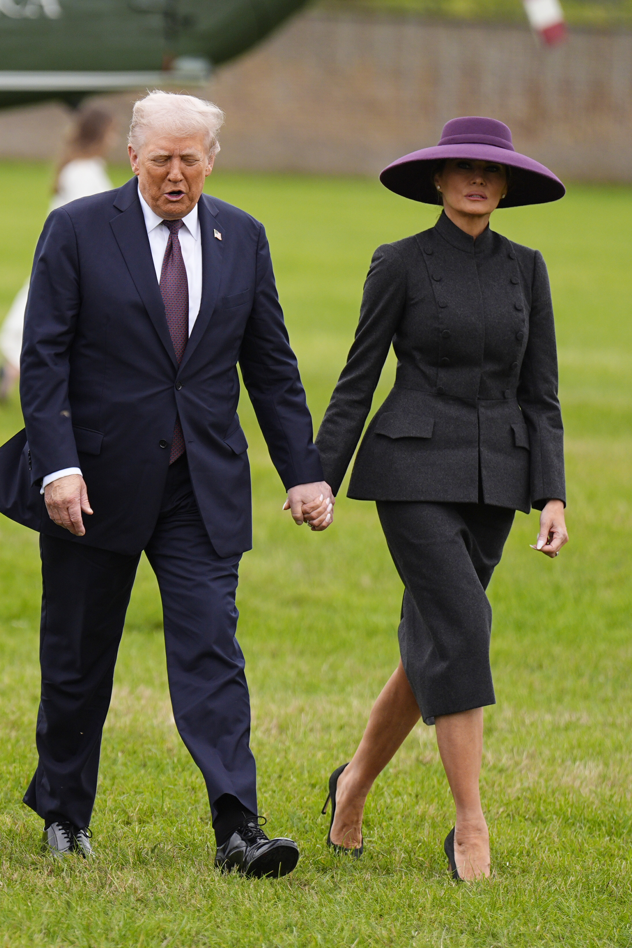 U.S. President Donald Trump and First Lady Melania hold hands as they arrive for a state visit at Windsor Castle in England on September 17, 2025 | Source: Getty Images